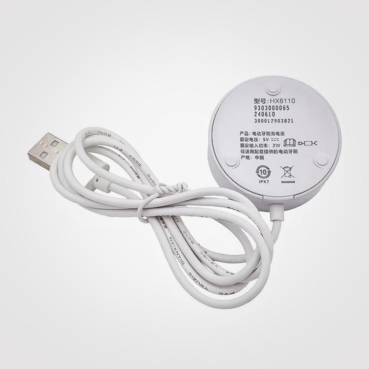 Round USB charger base underside with cable and printed specifications