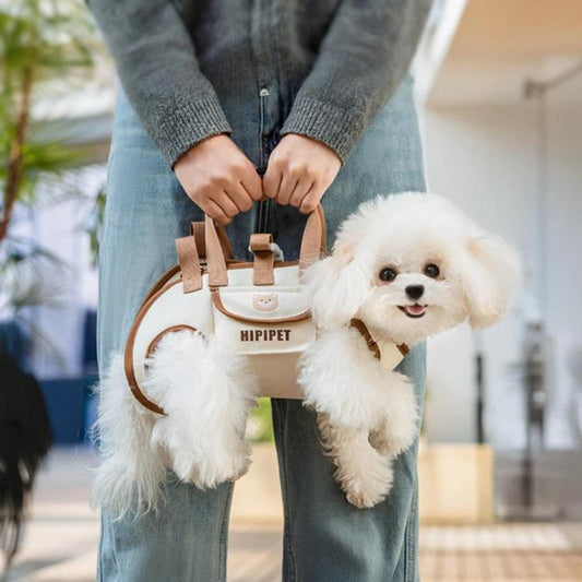 Brown portable pet shoulder bag carrier with handle and small dog