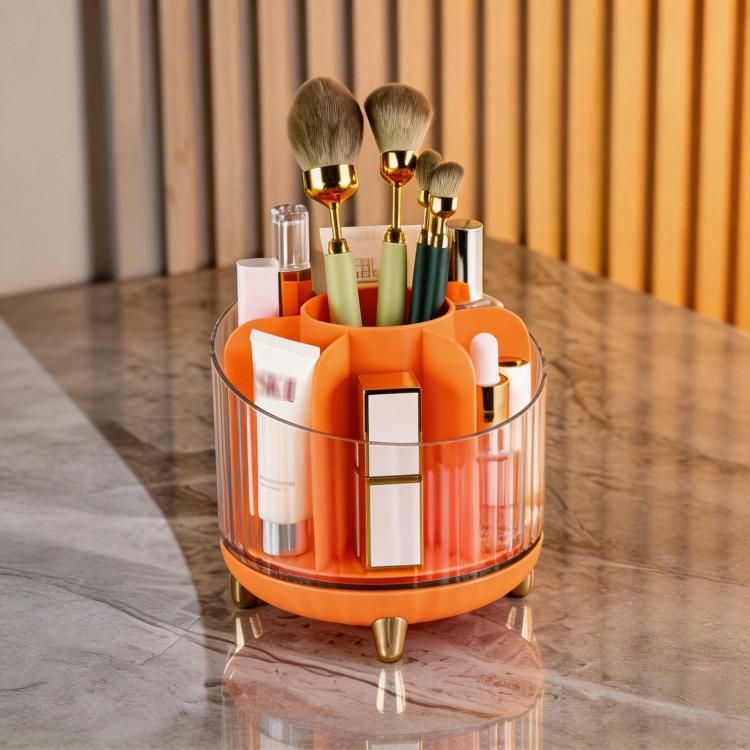 Red/orange rotating makeup organizer with clear container and multi-slot brush holder