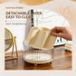 Detachable-layer rotating makeup organizer with beige insert inside clear container