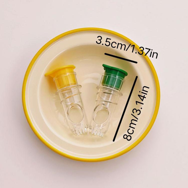 Compact two-piece manual citrus juicer set with clear chambers and green/yellow caps.