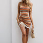 Orange and brown striped mini sundress with spaghetti straps and tassel hem