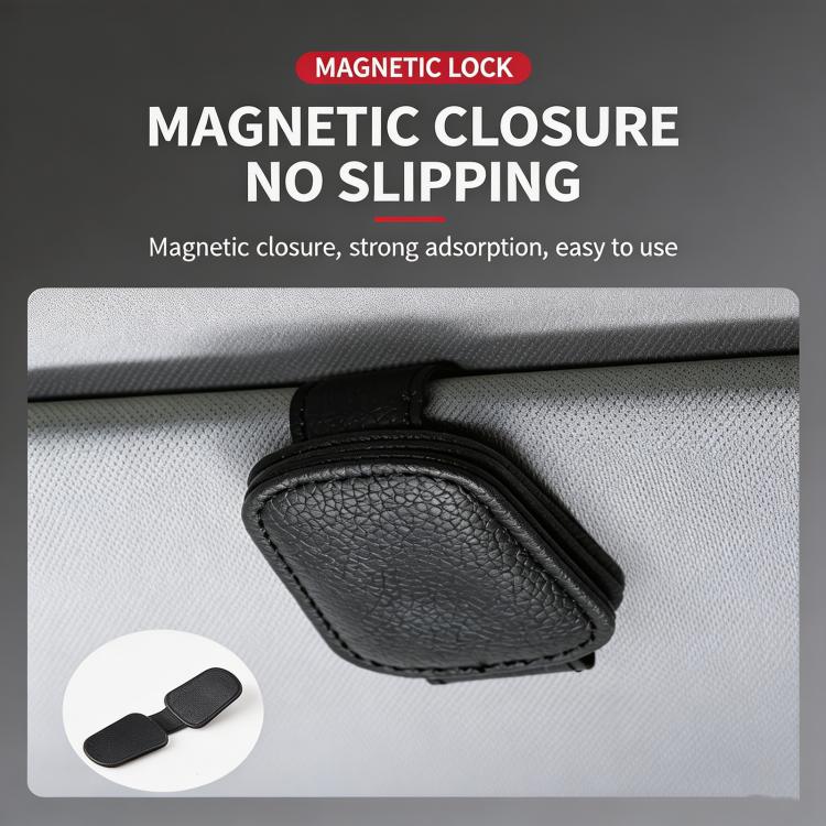 Black leather sunglasses holder clip mounted on car sun visor