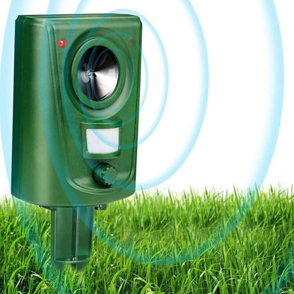 Green square outdoor animal repeller with circular sensor lens and stakes