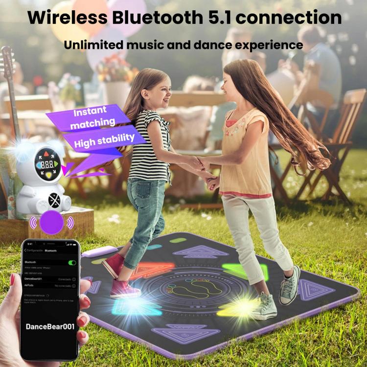 Kids dance mat on outdoor ground with illuminated tiles and wireless music host with screen
