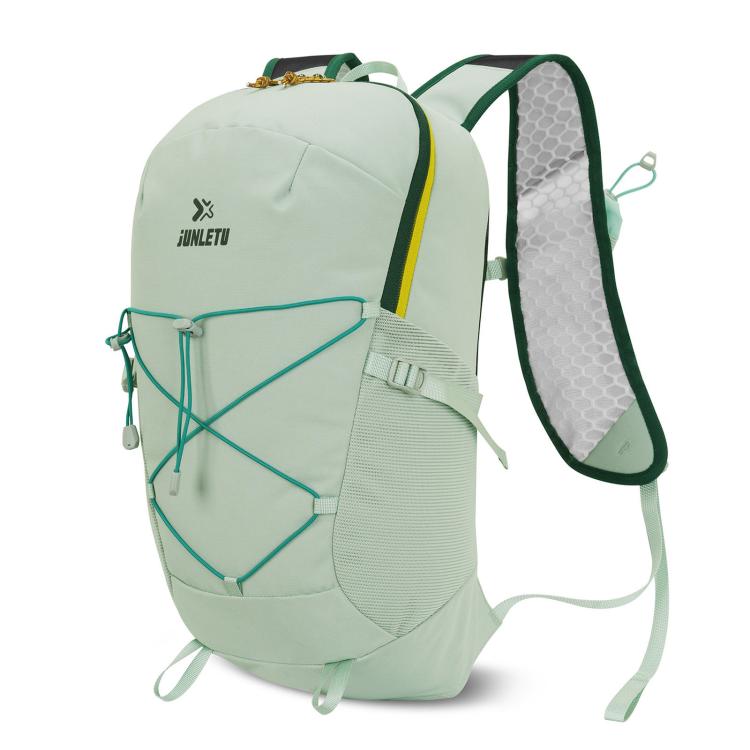 Light green waterproof trail backpack with ventilated back panel and front bungee cord
