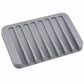 Gray silicone soap holder tray with vertical drainage ridges, no soap shown