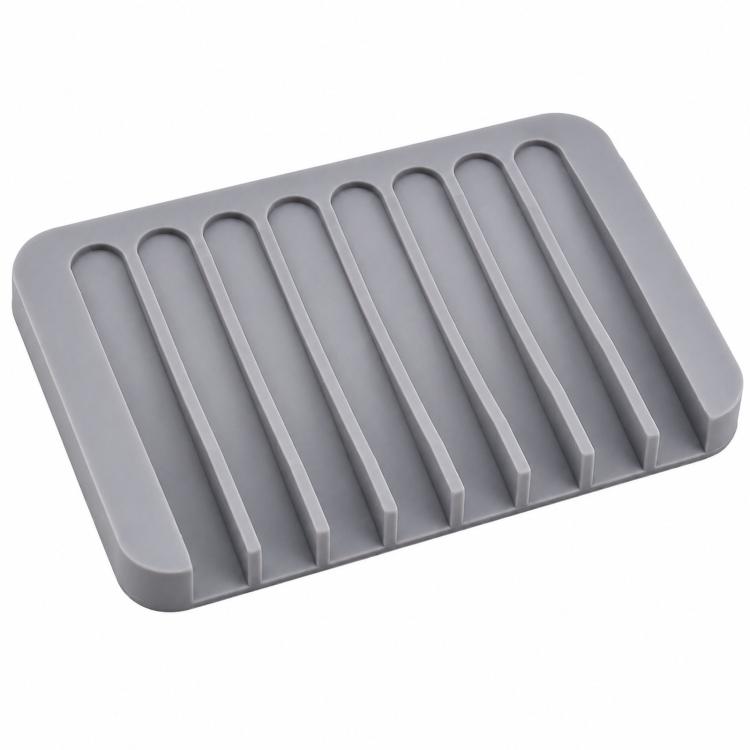 Gray silicone soap holder tray with vertical drainage ridges, no soap shown