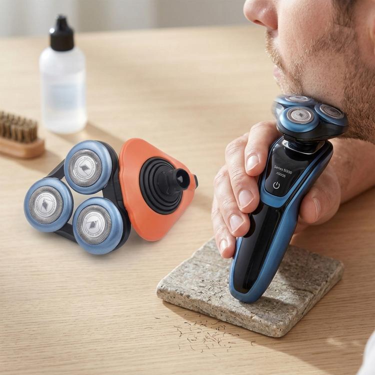 Orange and blue shaver head blades with three circular foil cutters