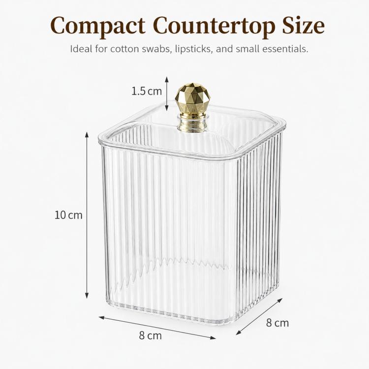 Compact clear plastic container with gold knob lid, 8 cm wide