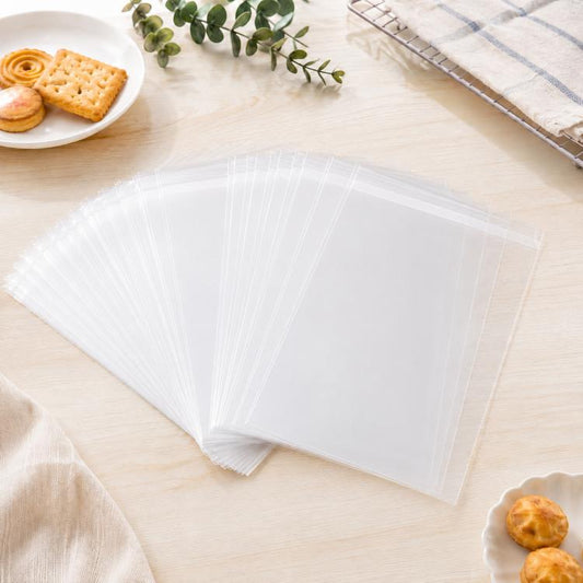 100pcs /Pack Clear Cellophane Bags Self Sealing Cello Bags 2.75 Mil Food Grade OPP Plastic Cookie Bags for Bakery, 4.7x5.9+1.2inch Flap