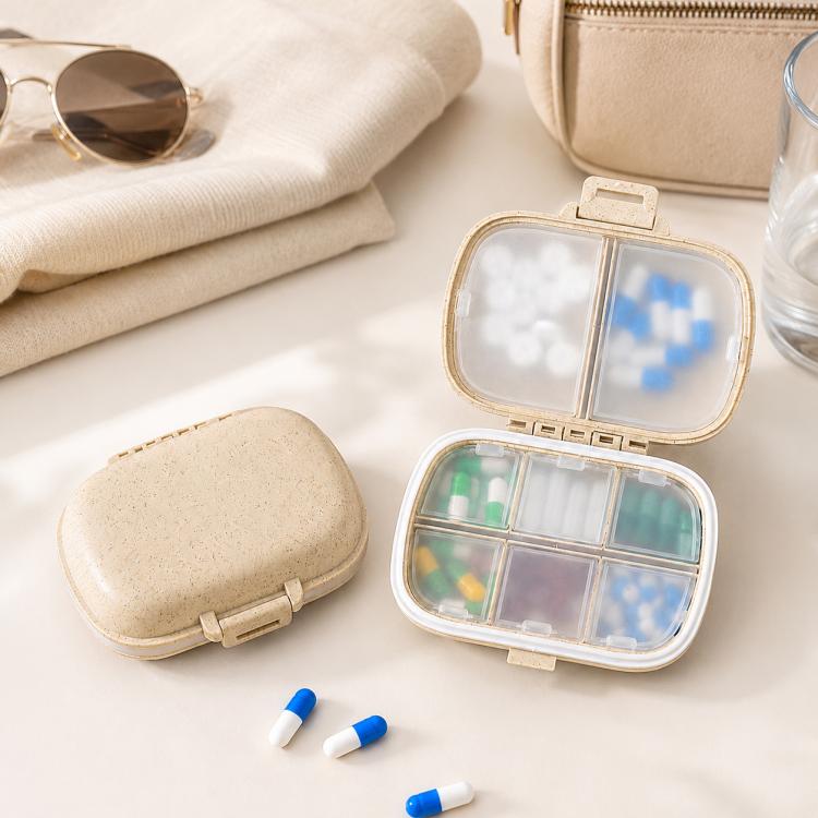 Wheat-straw pill organizer with clear lid showing 8 compartments and colorful pills