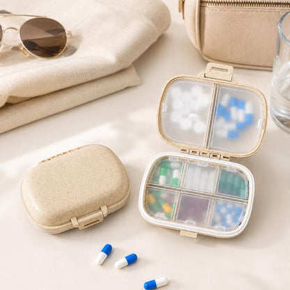 Wheat-straw pill organizer with clear lid showing 8 compartments and colorful pills
