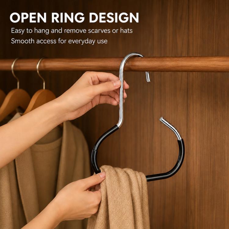 Metal open-ring hanger with black grips on a closet rod, holding a folded scarf