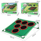 Green golf target practice mat with nine black holes in red rings and side frame