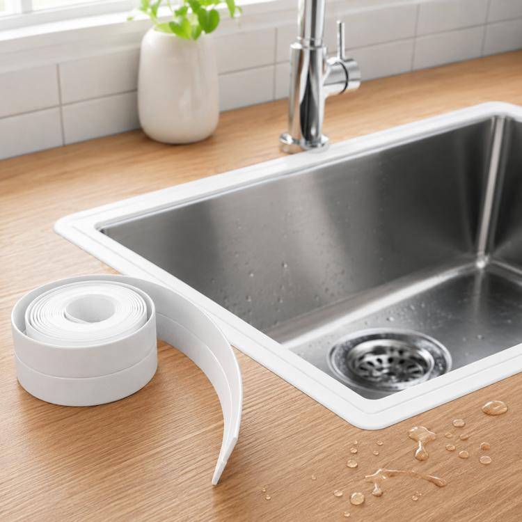 White self-adhesive caulk tape strip with peel backing along sink corner