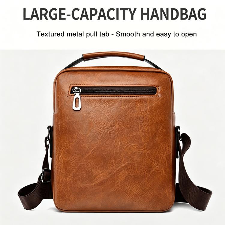 Tan leather-look large crossbody bag with top handle, front pocket, and zipper.