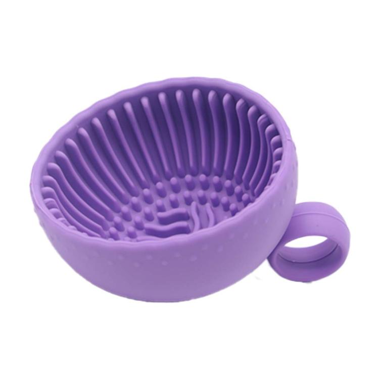 Purple silicone brush cleaning bowl with dense scrubbing ridges and side handle