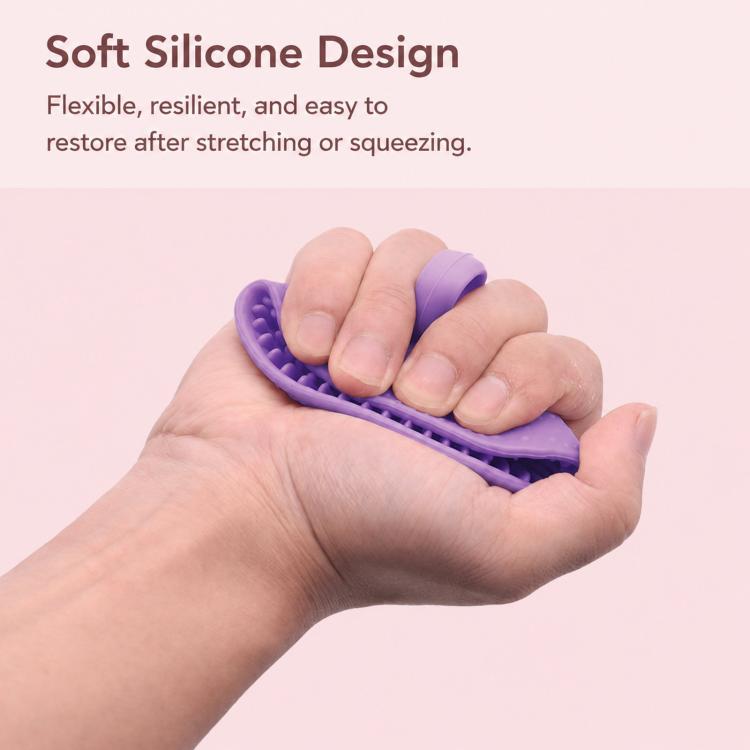 Purple silicone cleaning bowl held and squeezed by hands, with textured scrub surface