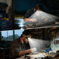 Glasses-style LED headlamp worn over eyes, shining light while working