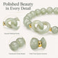 Green jade-style beaded bracelet with smooth interlocking double loop centerpiece