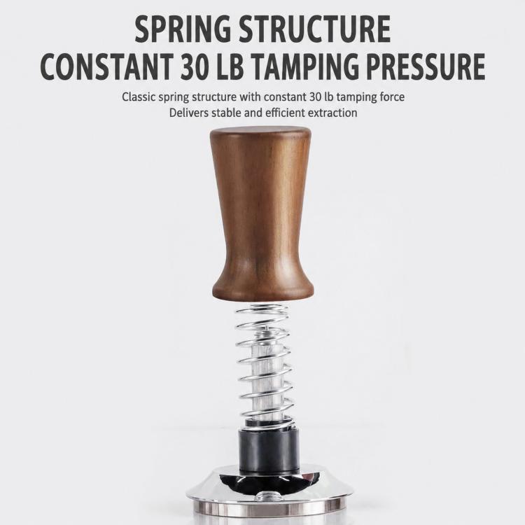 Spring-loaded coffee tamper with dark wood handle, visible internal coil spring