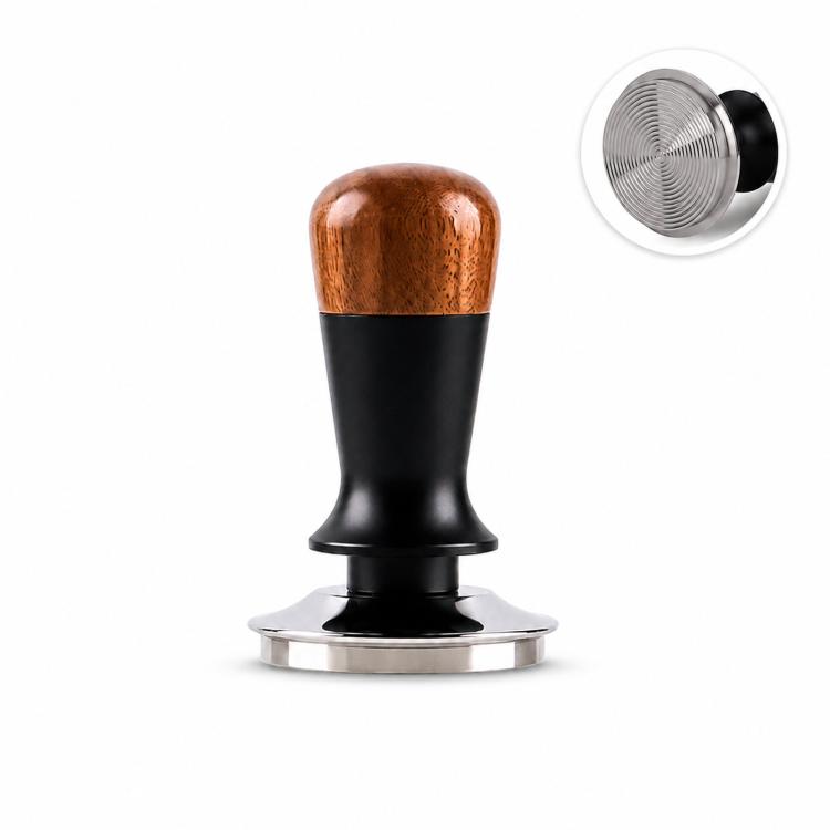 Coffee tamper with walnut wood handle, black body, and stainless flat base on a white stand