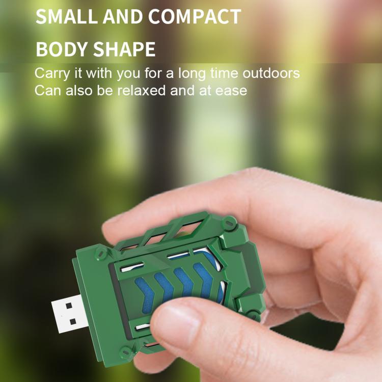 Green portable USB heated mosquito repellent device held in a hand