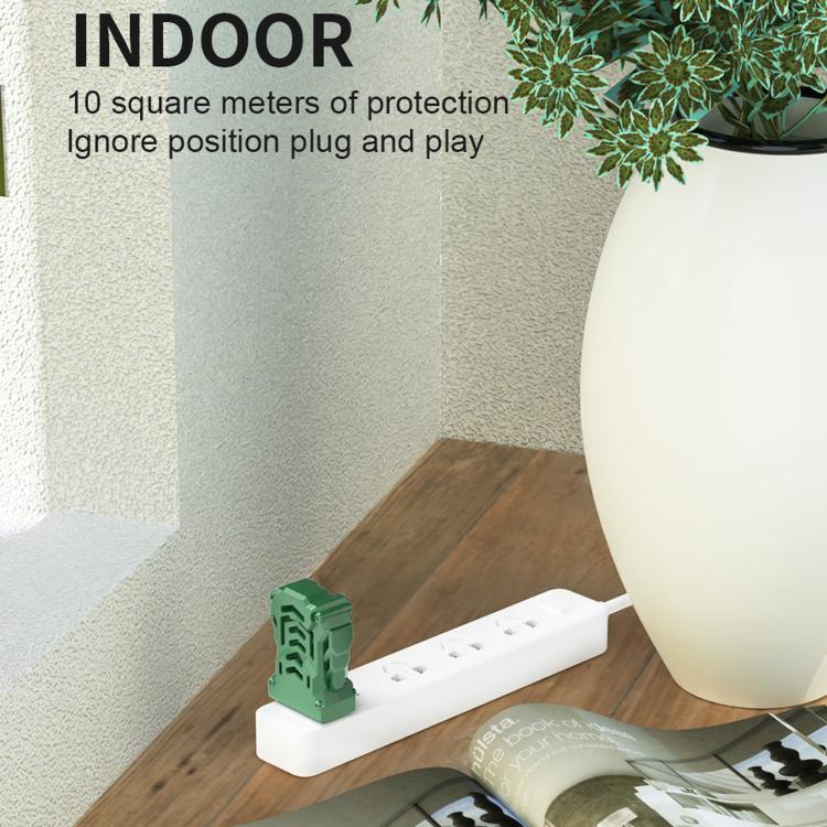 Green USB heated mosquito repellent device plugged near a wall outlet