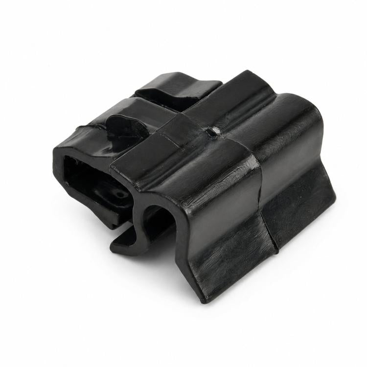 Black plastic storage compartment securing clip with snap-lock tabs