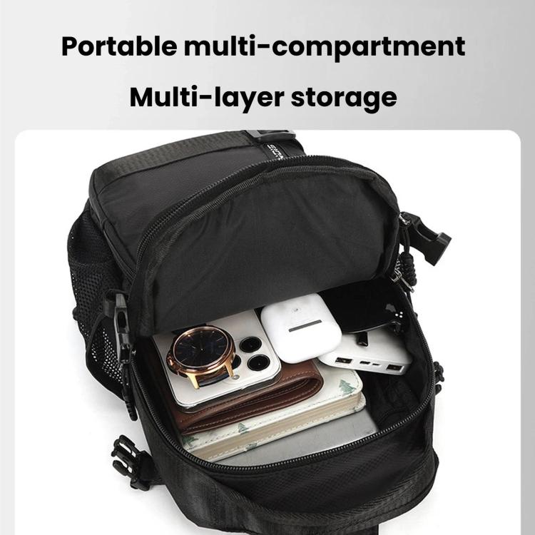 Black chest bag open to show multi-layer storage with phone and accessories pockets