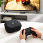 Hard-shell controller case placed on a table with a controller being inserted