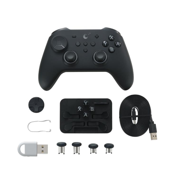 Black wireless game controller with adjustable joysticks, ABXY buttons, and accessory set