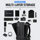 Black multi-compartment laptop backpack with organizer layout and front storage pockets