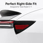Black taillight trim panel with red reflector installed on a white car rear quarter.