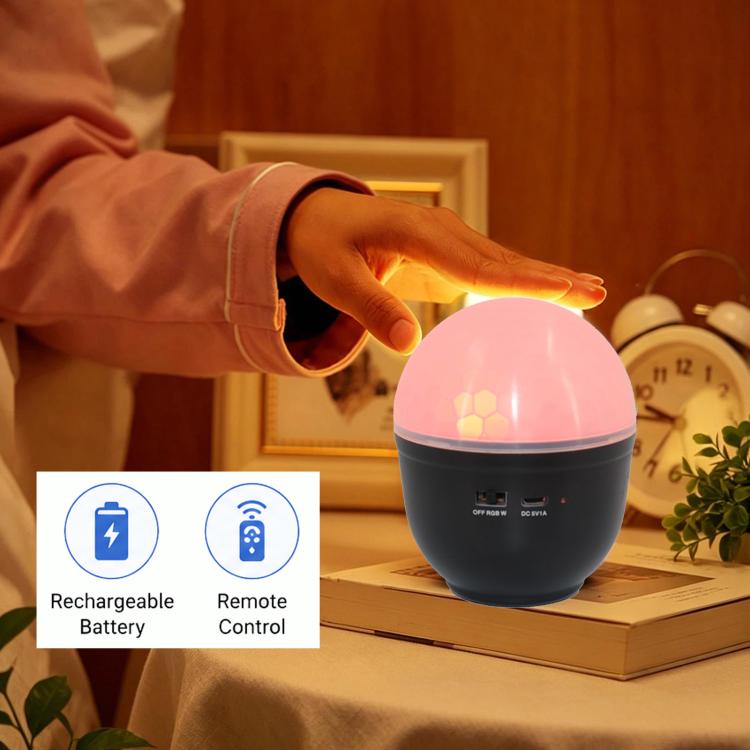 LED eye-caring night light with pink glow, dome top, near a reaching hand