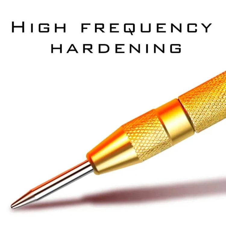 Close-up of gold knurled center punch body with sharp pointed tip