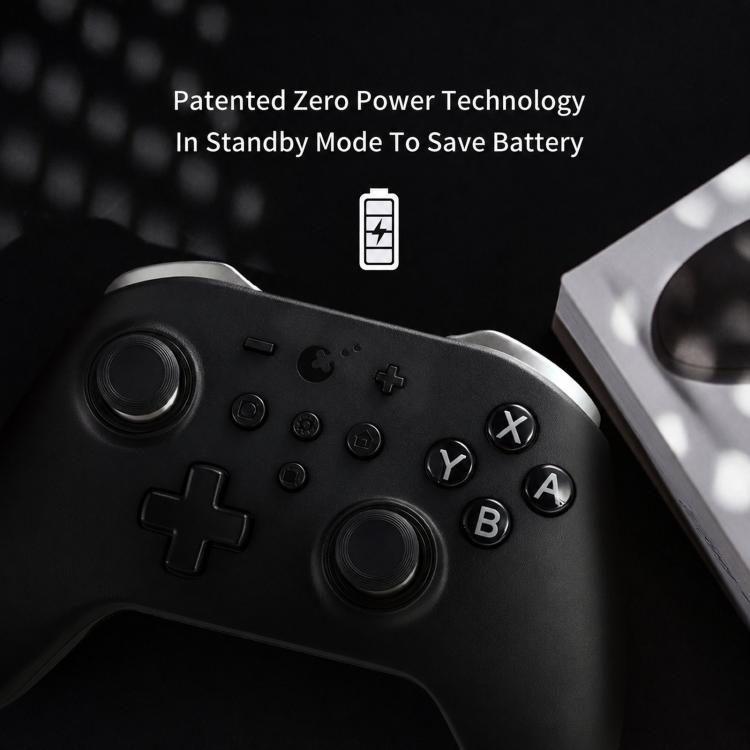 Black game controller close-up with left analog stick, D-pad, and X/Y/A/B buttons