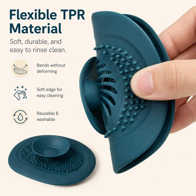 Teal flexible drain strainer cover with raised dots, bent for easy cleaning
