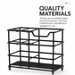 Black toothbrush storage rack with wide top tray and ribbed lower shelf
