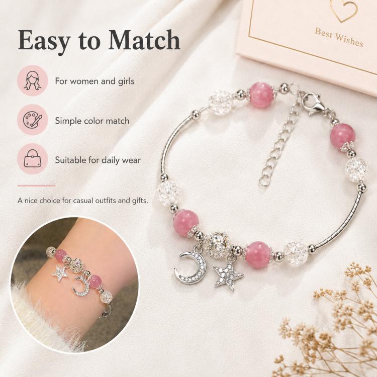 Pink and clear bead bracelet with star and moon charms on a silver-tone chain