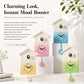 Set of house-shaped wall clocks with gradient faces and bird chime window detail