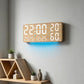 Wall-mounted woodgrain digital clock with large white LED time, temperature, and humidity readouts.