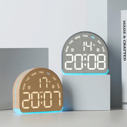 Pair of LED digital alarm clocks, wood and dark fabric cases, LED time and temperature displays