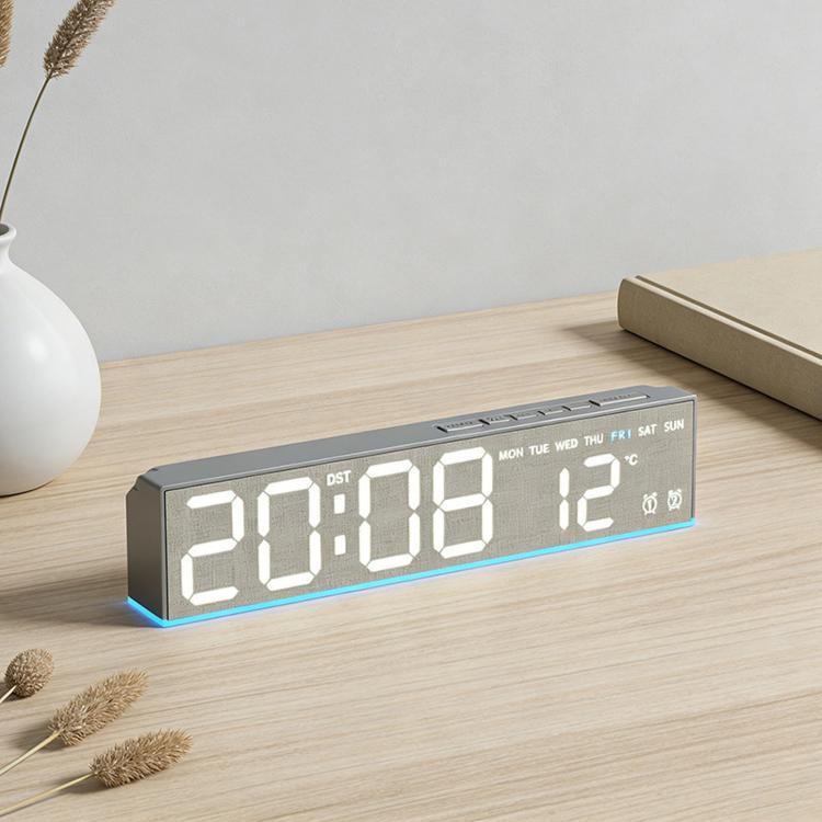 Fabric-style LED digital alarm clock with glowing time and temperature digits
