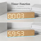 LED digital alarm clock with light wood body, large time digits, and blue glow line