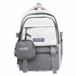 White school backpack with gray front pocket and detachable square coin pouch