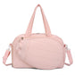 Pink waterproof duffel bag with top handles and side shoulder straps