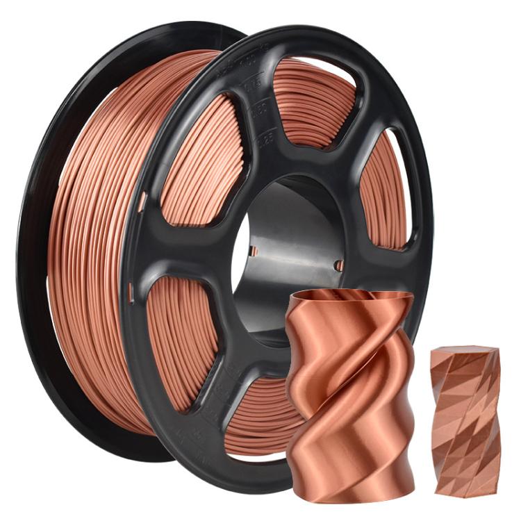 Copper metallic PLA filament on black spool with curled copper printed piece