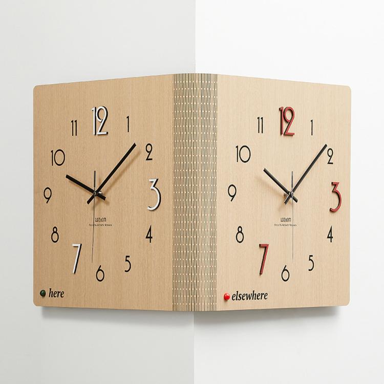 Woodgrain brown dual-sided corner wall clock with black hands and here/elsewhere markers